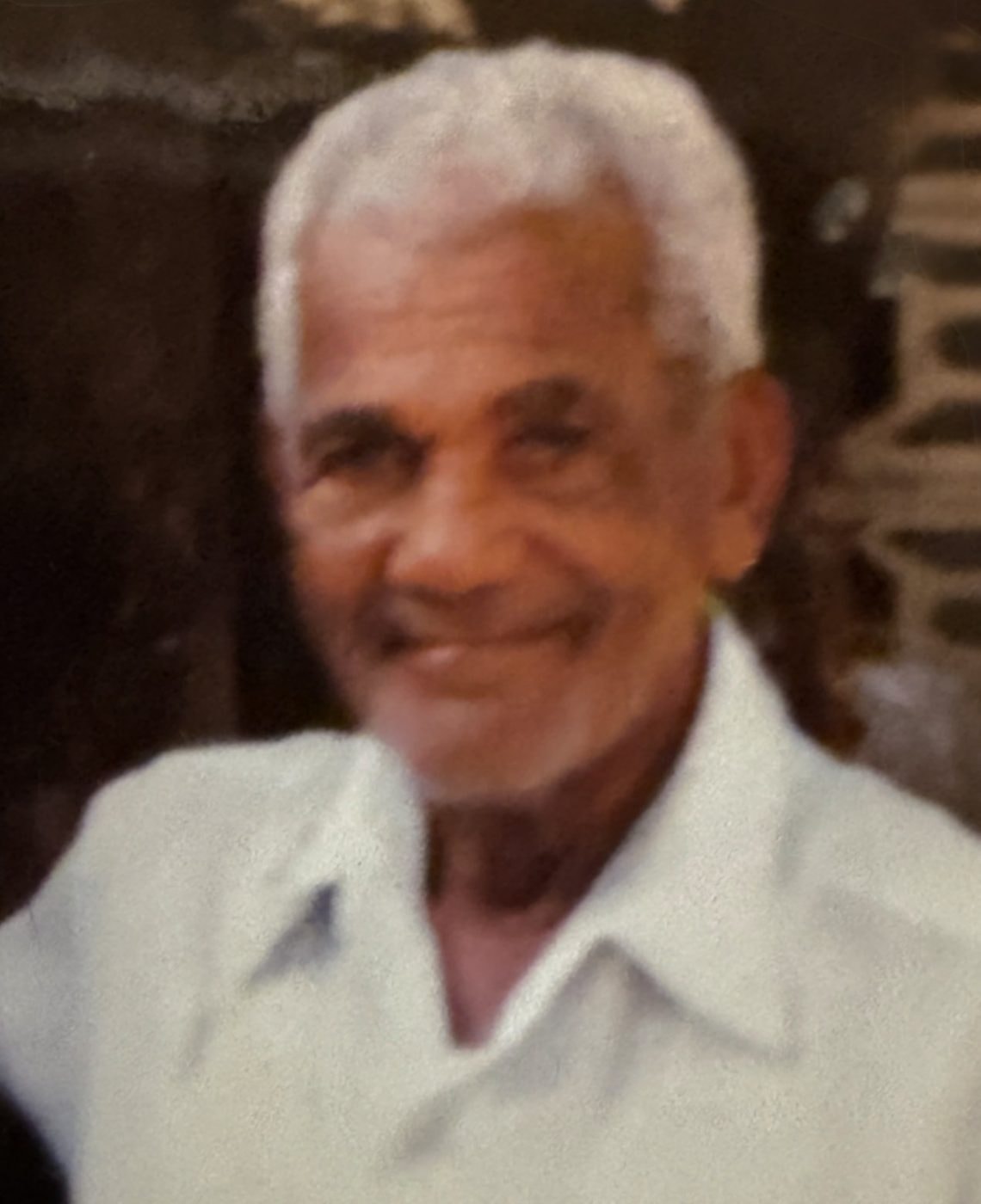 Papá — Natalie's maternal grandfather who raised her in the Dominican Republic